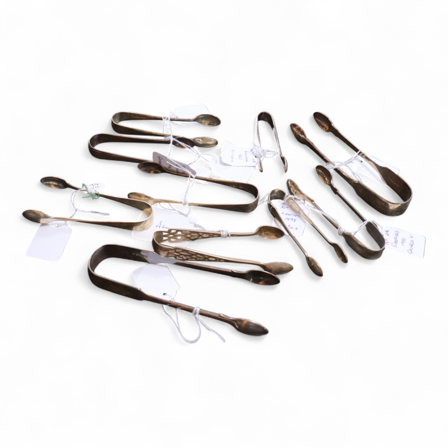 Ten assorted pairs of mainly 19th century silver sugar tongs, earliest pair by Jonathan Hayne, London, 1821.